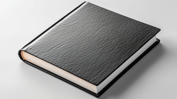 High quality black book with textured cover and blank pages photo