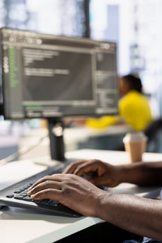 Programmer typing on keyboard, developing machine learning APIs solving complex problems. Close up of man writing code, training predictive models capable of handling complex tasks photo
