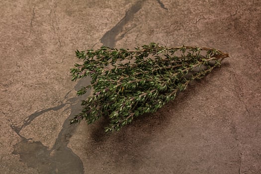 A bunch of herbs on a table photo
