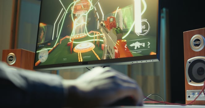Gamer using keyboard and mouse to play FPS singleplayer videogame on PC, enjoying leisure time. Person in apartment at night using high tech computer peripherals to destroy enemies, camera B close up photo