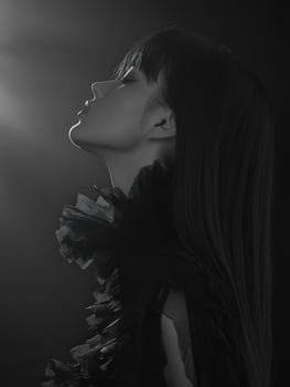 Elegant portrait of a woman in profile against a dark background photo