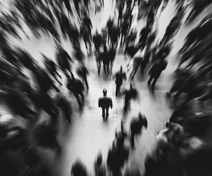 Urban figure stands still amid a crowd in a vibrant city setting photo