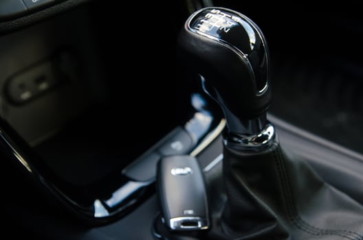 Close up of a modern car's gear stick and key fob photo
