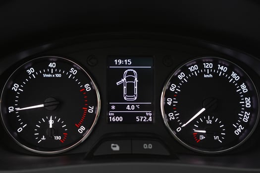 Car dashboard displaying speed RPM fuel level and time photo