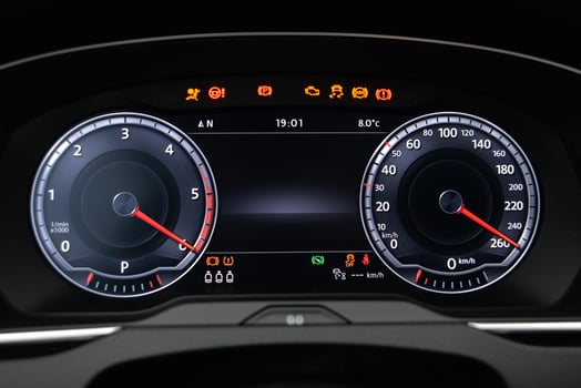 Car dashboard display showing speed RPM and warning lights photo