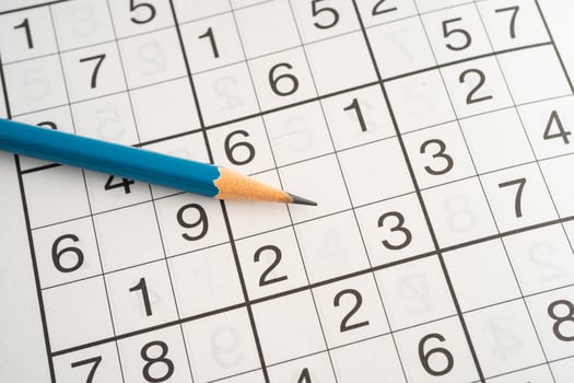 Sudoku puzzle game playing to challenge brain. photo