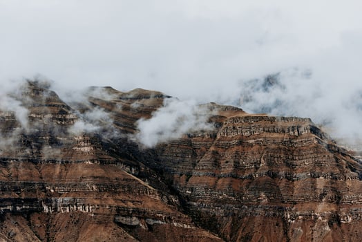 Landscape of snowy fine mountains mountain range in haze summer photo
