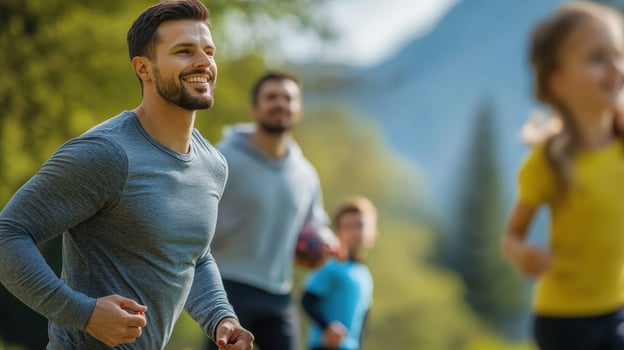 Joyful Man Running Outdoors with Friends in a Scenic Nature Setting photo