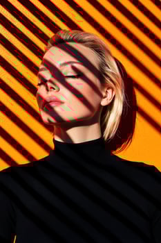 Woman with eyes closed, sun shining through blinds, orange background photo