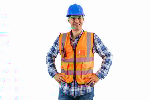 Construction worker in blue helmet and orange safety vest smiling, hands on hips white background photo