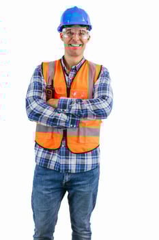 vertical Smiling construction worker with arms crossed wearing orange vest and safety helmet photo