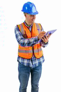 vertical Construction worker writing in a notebook with a pen wearing orange vest and safety helmet photo