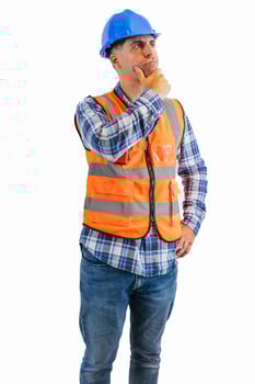 vertical construction worker resting his chin while reflecting wearing orange vest and safety helmet photo