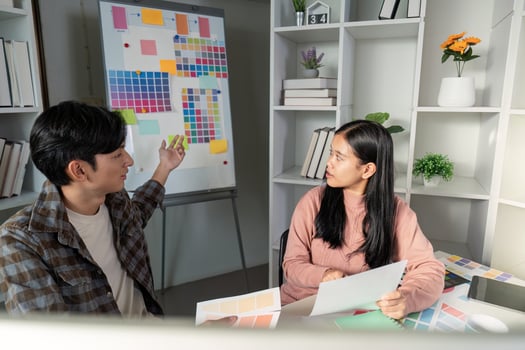 Creative team designs graphics during strategic meeting office workspace collaborative environment engaging viewpoint photo