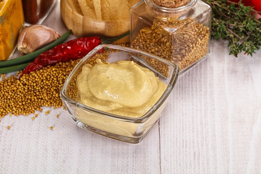 A table with a variety of spices and condiments photo