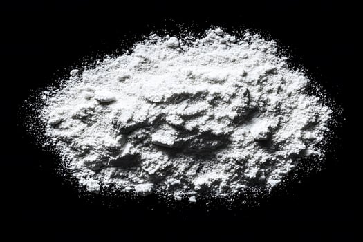 Fine White Powder Pile on Black Background for Stock Photography and Design photo