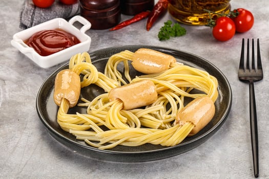 A plate with spaghetti and sauce on it photo
