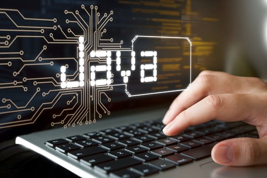 JAVA text with circuitry and hand typing, emphasizing software development theme photo