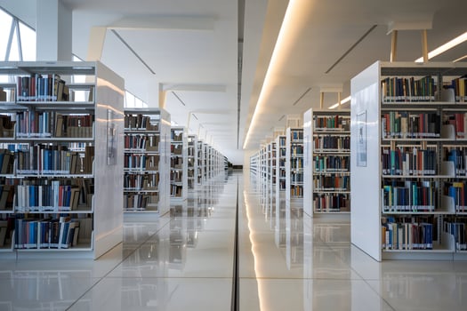 Modern library with white shelves, clean lines, and spacious reading environment photo