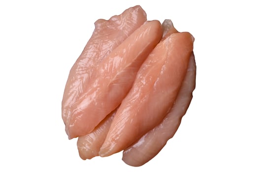 Raw chicken fillet cut into strips with spices and herbs, isolated photo