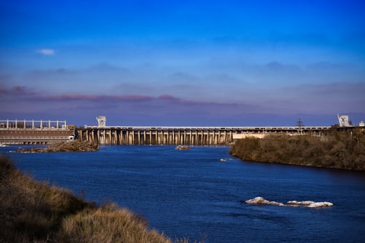 Dam. Dnieper Hydroelectric Station Zaporozhye Ukraine. Blue river with sky in the background. photo