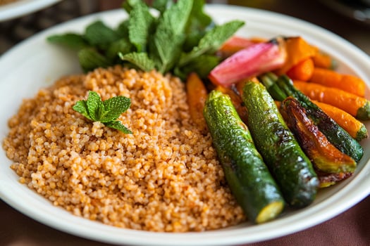 A plate of food with vegetables and rice photo