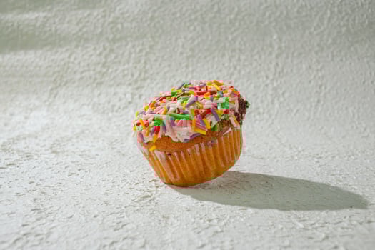 a cupcake with sprinkles on it photo