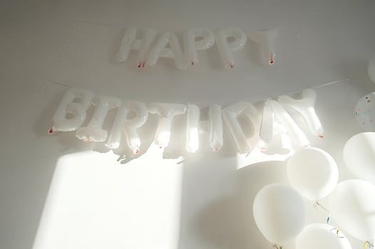 White wall decorated for birthday party. photo