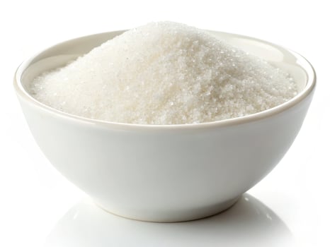 bowl filled with white granulated sugar, perfect for baking photo