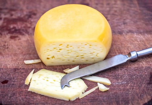 Original Brazilian rustic cheese known as meia cura top view, photo