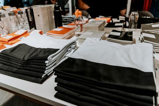 Market sells nice clothes, fabrics on shelf of store photo