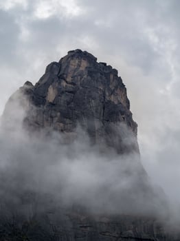 Dramatic deep dangers gorge with sharp sheer crags silhouettes photo