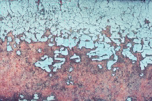 A close up of a wall with paint peeling off photo