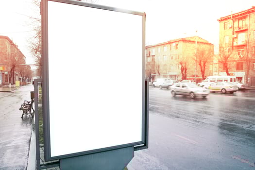 An empty billboard on the side of a street photo