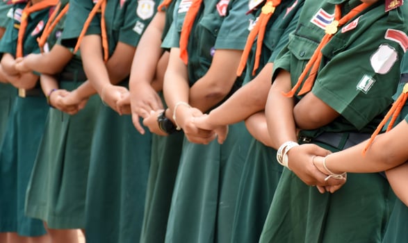 A group of people wearing green uniforms photo