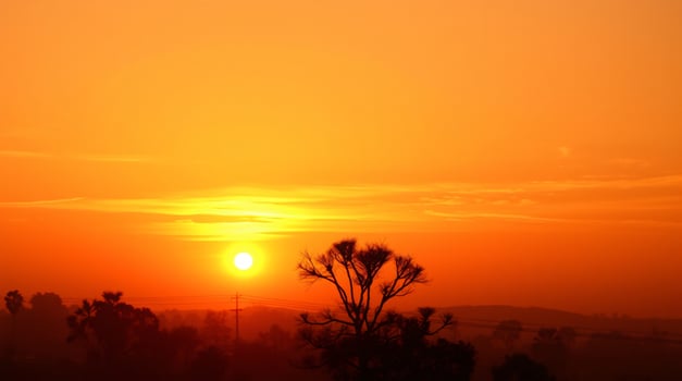 The golden sky glows as the sun is about to set. photo