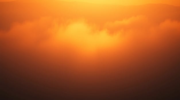 A plane flying over the clouds at sunset photo