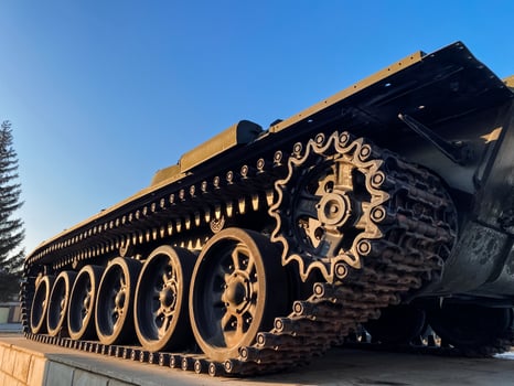 A tank equipped with numerous gears positioned on it, showcasing the intricate engineering involved in its design and functionality, thereby enhancing its overall performance photo