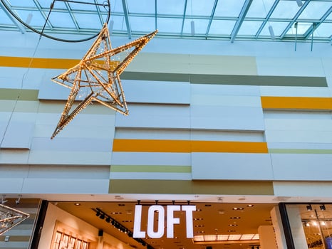 A beautifully designed loft store features a stunning star hanging from the ceiling, enhancing the ambiance and charm, making it a captivating destination for all visitors photo
