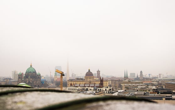 Berlin skyline with historic and modern sights. Panoramic birds eye view of foggy Berlin from the rooftop of French Church. Historic and modern landmarks on a misty day. Copy space 10 photo