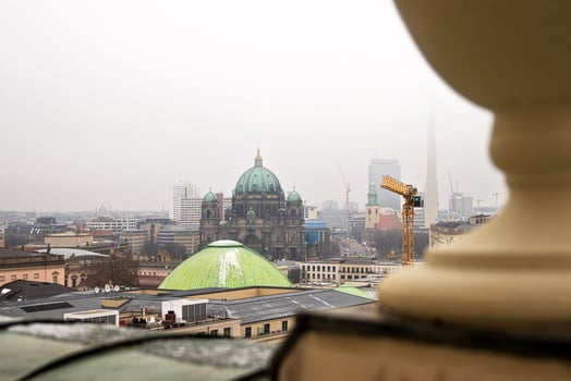 Berlin skyline with historic and modern sights. Panoramic birds eye view of foggy Berlin from the rooftop of French Church. Historic and modern landmarks on a misty day. Copy space 6 photo