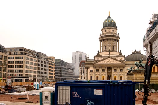 Berlin, Germany, January 6th, 2024. French Church Franzoesischer Dom and reconstruction of Concert Hall Konzerthaus on Gendarmenmarkt. Frisch and Faust tiefbau equipment, mobile toilets from Toi Toi 3 photo