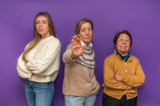 Three generations of women showing female symbol and claiming equality photo