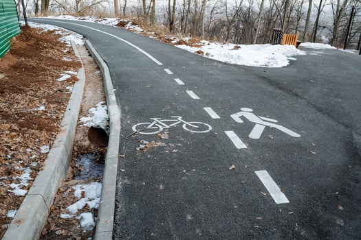 A bicycle lane is specifically painted on the side of a road to provide a designated space for cyclists, ensuring their safety and promoting cycling as a mode of transportation photo