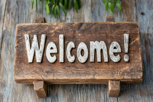 Rustic wooden welcome sign with white lettering photo