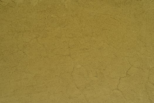 a brown wall with cracks photo