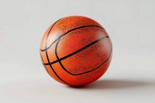 Orange basketball ball resting on white background photo