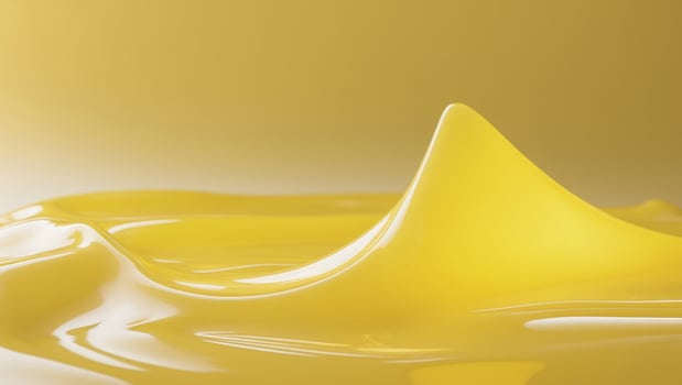 A close up of a yellow liquid on a yellow backgroundA close up of a yellow liquid on a yellow background. photo