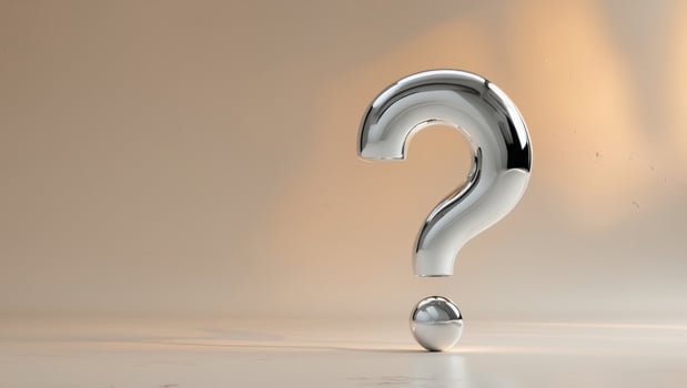 Shiny question mark on a beige background photo