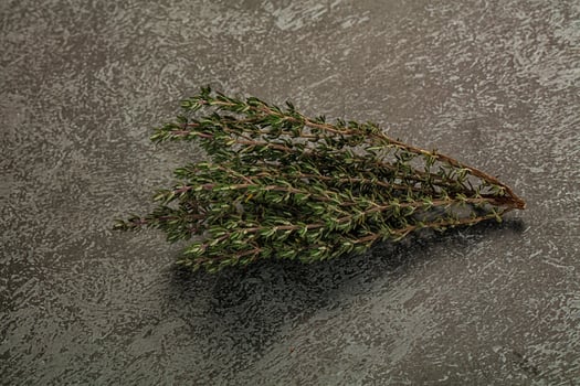 A bunch of herbs on a table photo